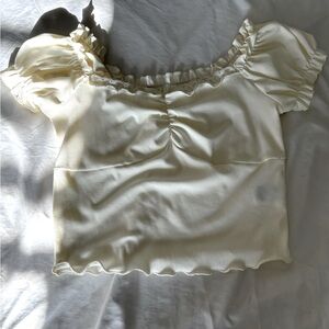Short sleeve white top with ruffle detail